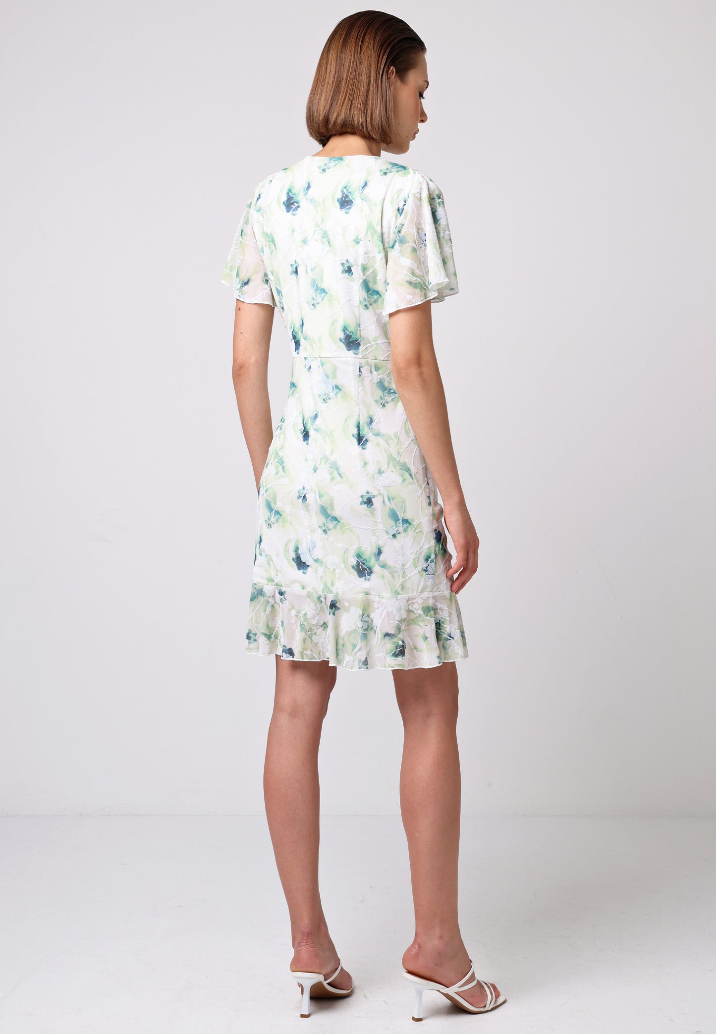 Wrap Ruched Mini Dress with Ruffle Hem in Green Floral Burnout Print