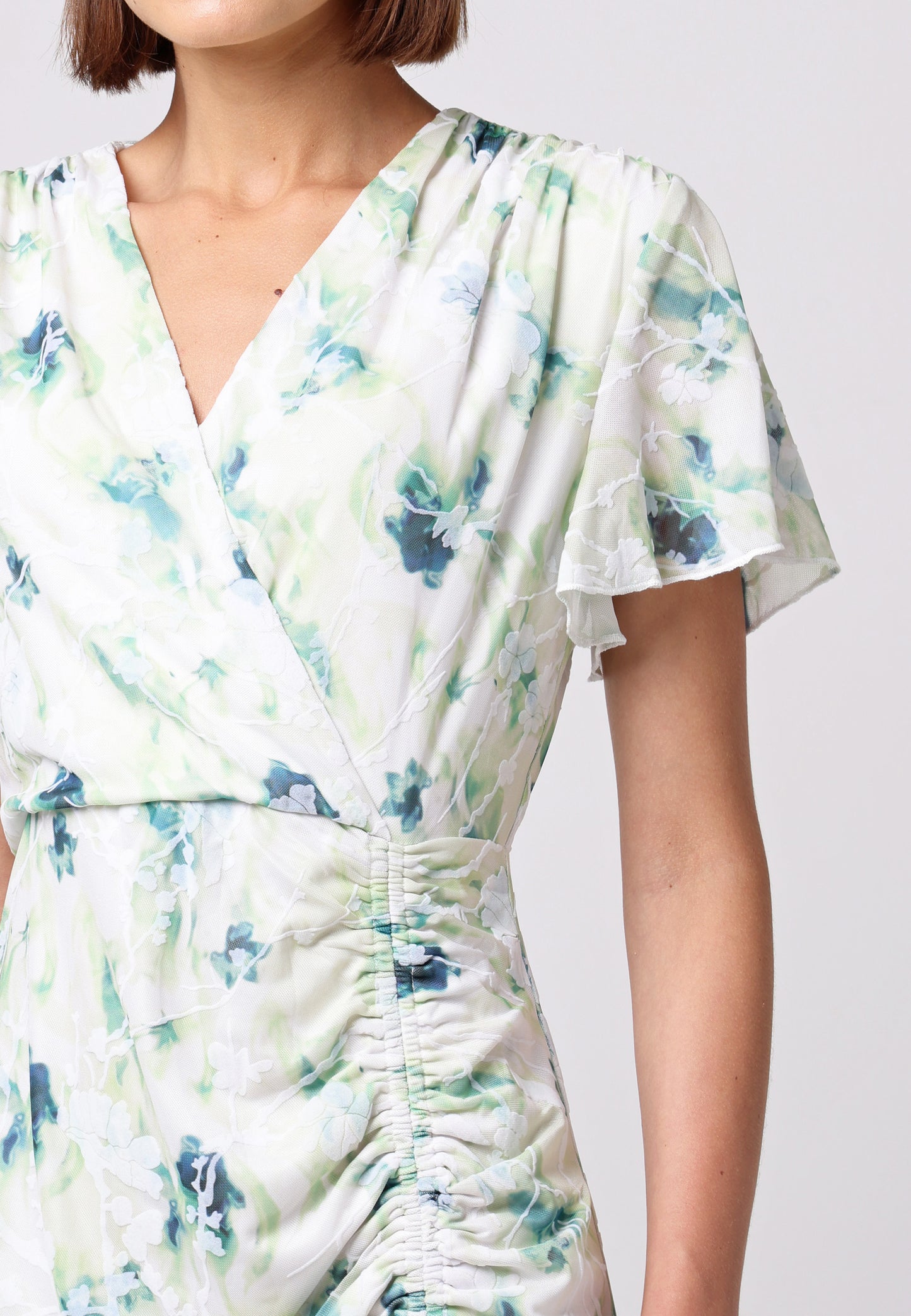 Wrap Ruched Mini Dress with Ruffle Hem in Green Floral Burnout Print